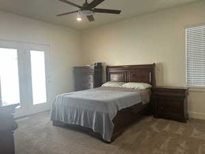 Bedroom with dark colored carpet, recessed lighting, and a ceiling fan