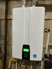 Utility room featuring water heater