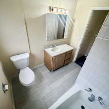 Bathroom with vanity and light tile patterned floors