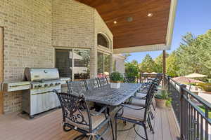 Deck featuring a grill and outdoor dining area