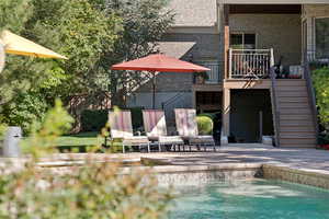 Swimming pool with stairway and a patio area