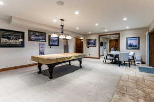 Playroom featuring recessed lighting, billiards table, stone tile floors, and light colored carpet