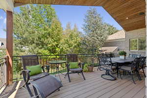 Wooden terrace featuring outdoor dining space