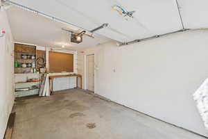 Garage featuring a garage door opener