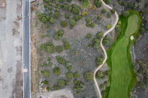 Aerial overview of property's location featuring a golf club