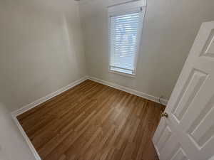 Spare room with light wood-style flooring and baseboards