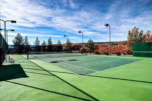 View of tennis court with community basketball court