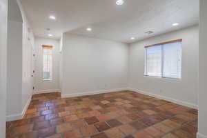 Spare room featuring recessed lighting and a textured ceiling