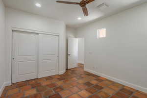 Unfurnished bedroom with a closet, recessed lighting, and a ceiling fan