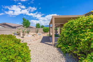 Fenced backyard featuring a patio area and a mountain view