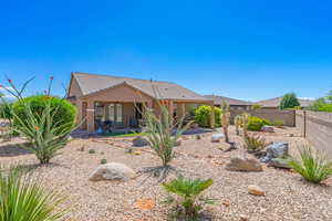 Back of house with a patio area, a fenced backyard, stucco siding, a tiled roof, and french doors