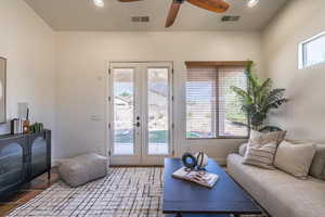 Living room featuring french doors, recessed lighting, and ceiling fan