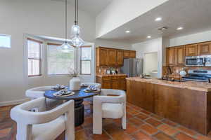 Dining space with recessed lighting, a textured ceiling, and washer / dryer