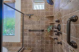 Full bathroom with a stall shower