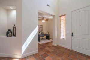 Foyer entrance featuring baseboards