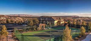 View of tennis court with a mountain view
