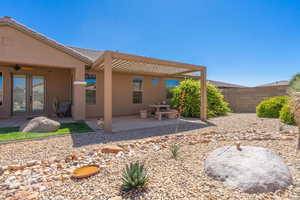 Back of house with a patio, stucco siding, french doors, and a ceiling fan