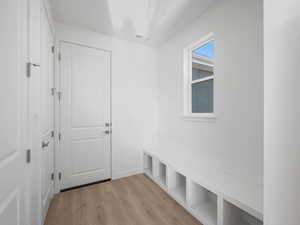 Mudroom featuring light wood-type flooring