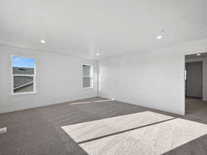 Empty room featuring carpet and recessed lighting