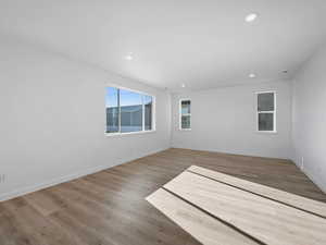 Spare room featuring light wood-style floors and recessed lighting