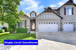Craftsman inspired home with stone siding, a front yard, concrete driveway, and stucco siding