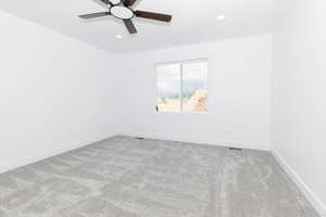 Empty room featuring carpet flooring, recessed lighting, and ceiling fan