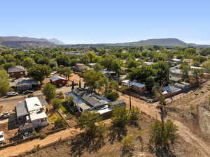 Aerial view of residential area featuring a mountainous background