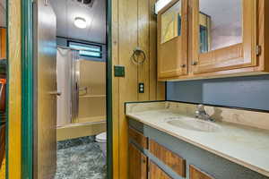 Bathroom with vanity and shower / bath combo with shower curtain