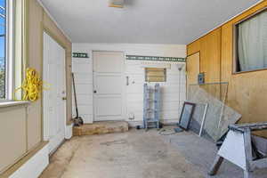 Garage featuring wood walls