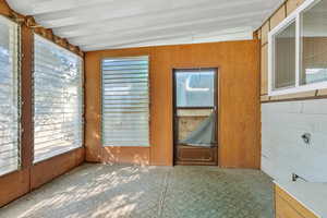 Unfurnished sunroom with plenty of natural light