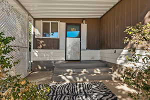 Doorway to property with a porch