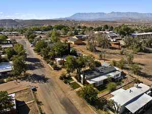 Aerial perspective of suburban area with a mountain backdrop