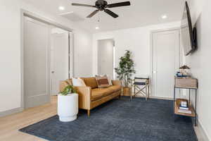 Living area featuring recessed lighting, light wood-style floors, and a ceiling fan