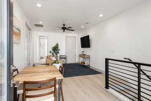 Dining area featuring light wood finished floors, recessed lighting, and ceiling fan