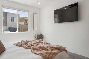 Bedroom with recessed lighting and baseboards