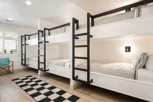 Unfurnished bedroom with light wood-style floors and recessed lighting