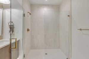 Bathroom featuring a stall shower and vanity