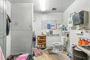 Misc room featuring a textured ceiling