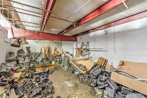 Garage featuring concrete block wall