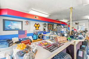 Miscellaneous room featuring a textured ceiling