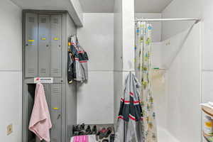 Full bathroom with curtained shower