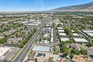 Aerial view of property's location featuring a mountain backdrop