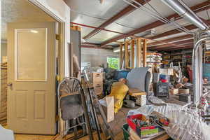 Below grade area featuring tile patterned flooring