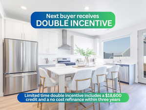 Kitchen with appliances with stainless steel finishes, light wood finished floors, wall chimney exhaust hood, recessed lighting, and white cabinetry