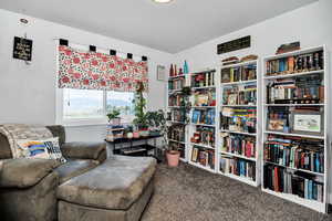 Bedroom being used as a sitting room overlooking Cache Valley