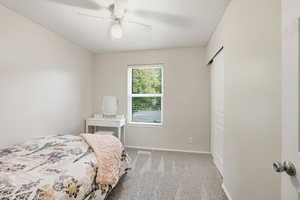 Bedroom featuring carpet and a ceiling fan