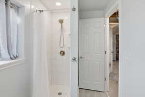 Bathroom featuring a shower stall
