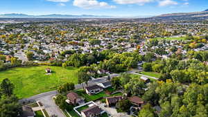 Aerial perspective of suburban area with a mountainous background