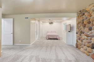 Unfurnished bedroom featuring carpet flooring and baseboards