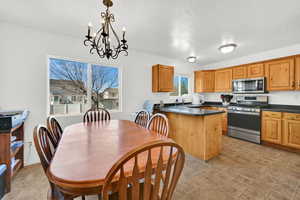 Kitchen featuring a peninsula and stainless steel appliances
